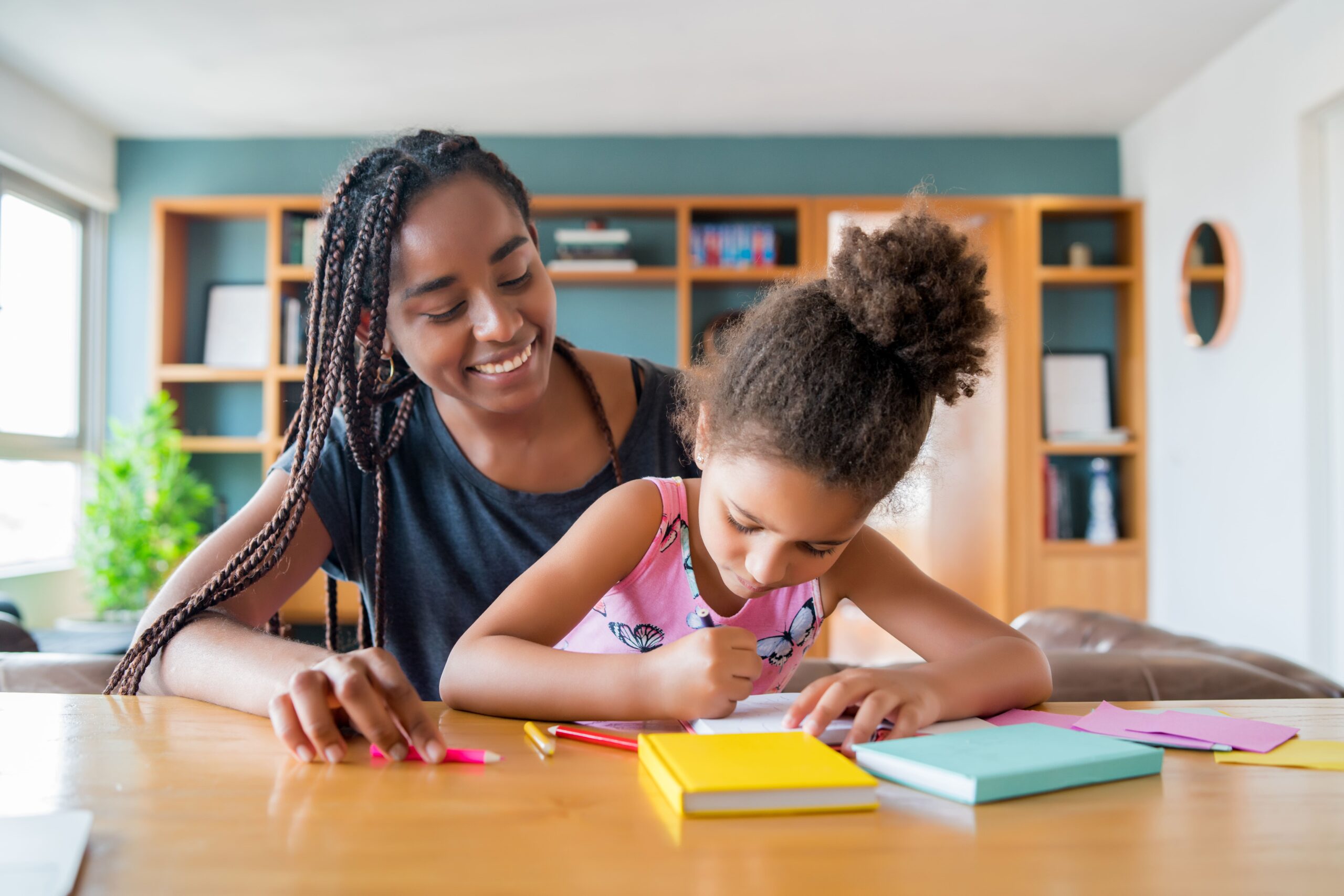 mother-helping-supporting-her-daughter-with-homeschool-while-staying-home-new-normal-lifestyle-concept (1)